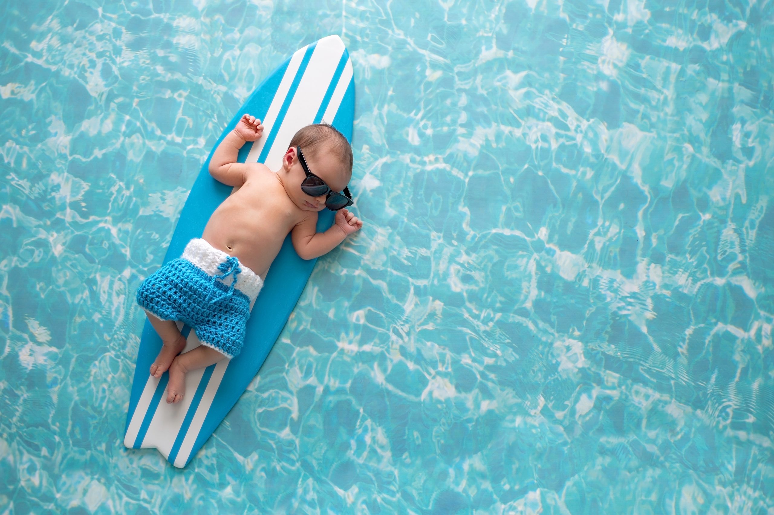 Newborn Baby Boy on Surfboard