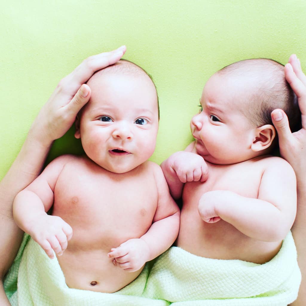 Meant to be Sleeping twins, awake being calmed by fathers arms